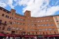 SIENA, ITALY Ã¢â¬â MAY 25, 2017: Campo Square Piazza del Campo, Palazzo Pubblico and Mangia Tower Torre del Mangia. Royalty Free Stock Photo